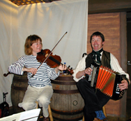 Sharon and Tim performing on board ship...